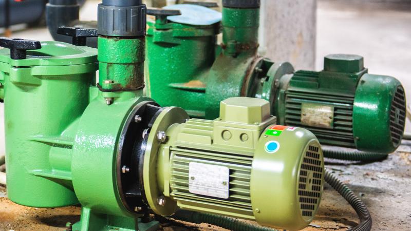 two green vacuum pumps